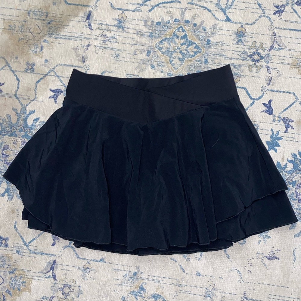 black criss cross tennis skirt
